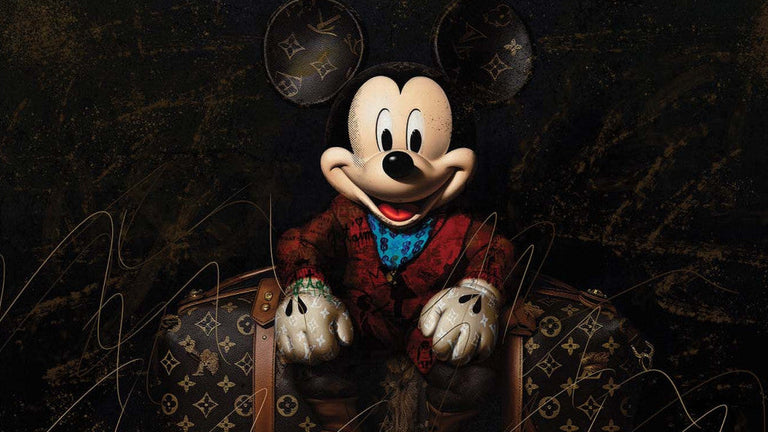Mickey Mouse in formal attire sitting on a suitcase with a dark background